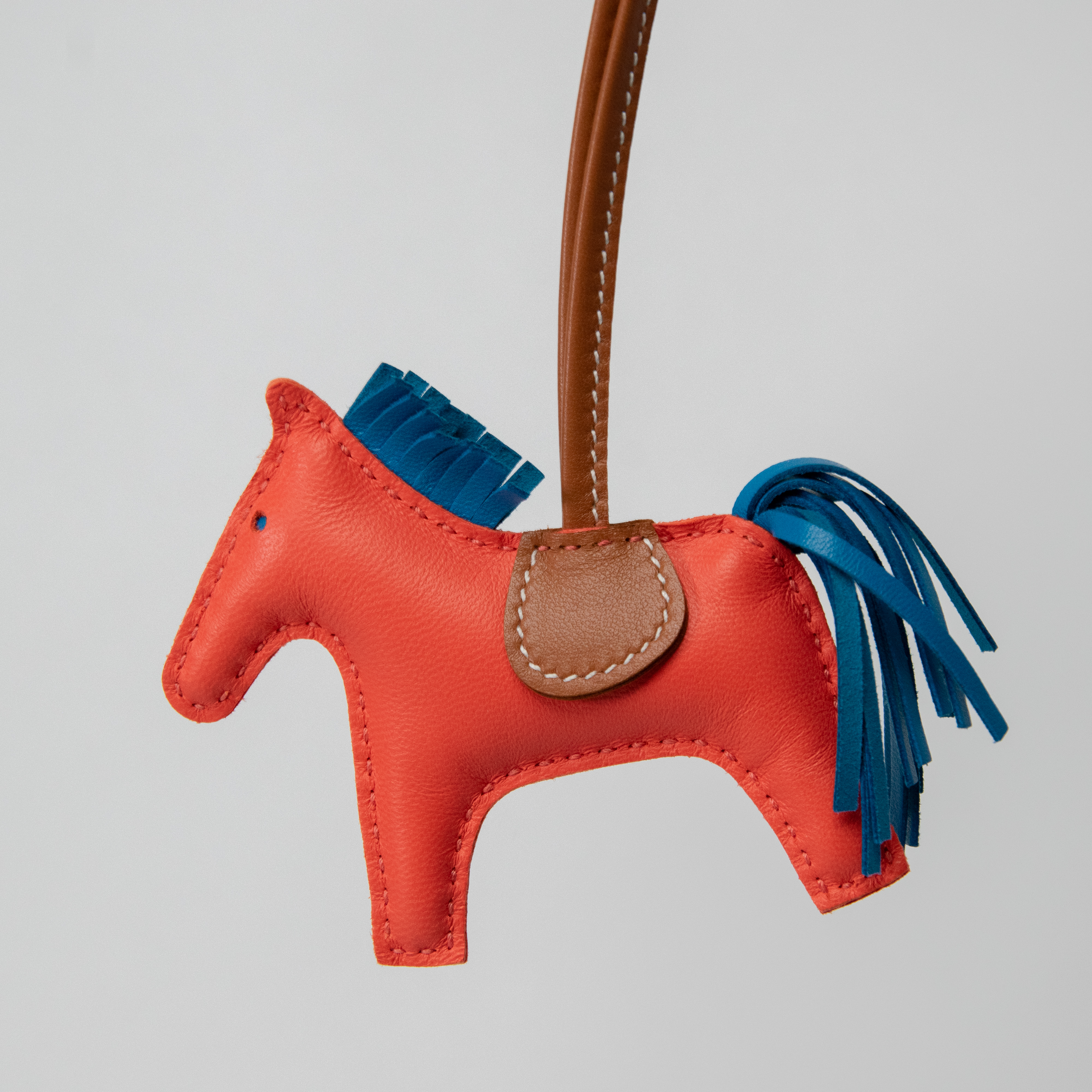 Hermès Rodeo PM horse pendant coral