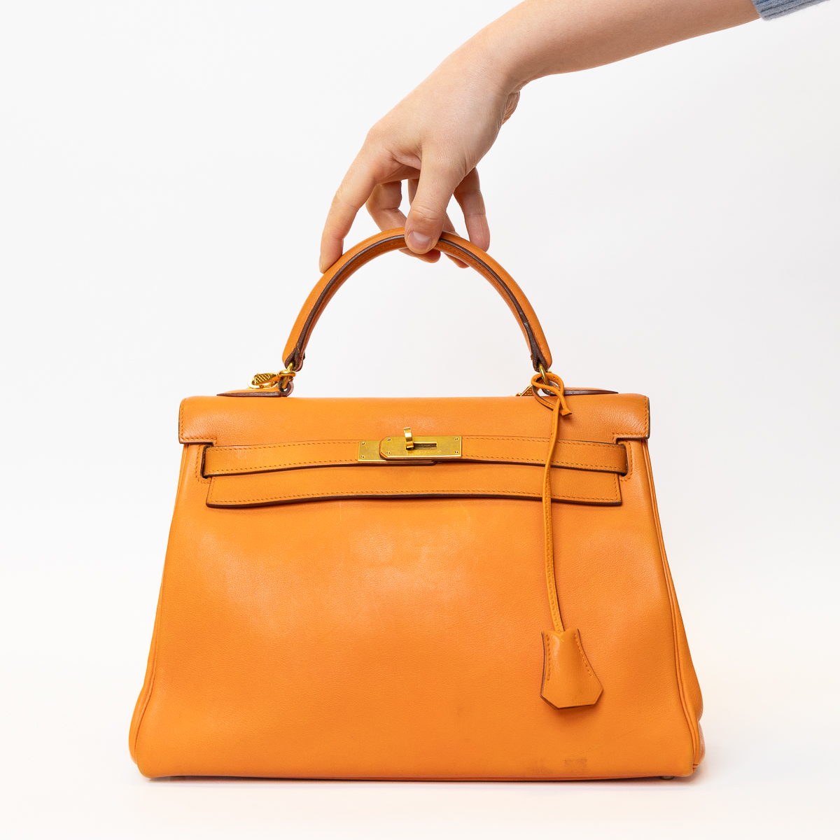Hermès Kelly Retourne 32 bag orange with shoulder strap